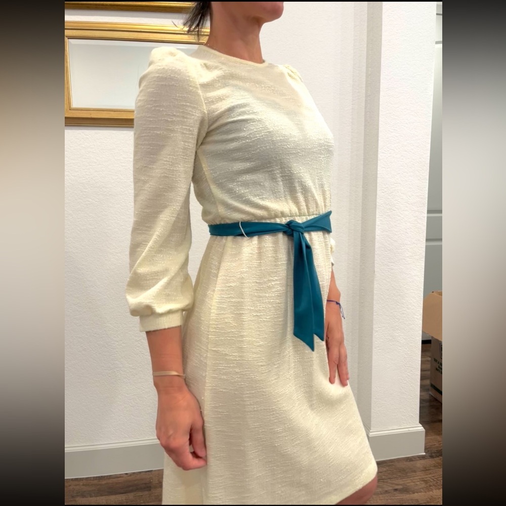 Elegant Cream Dress with Teal Belt